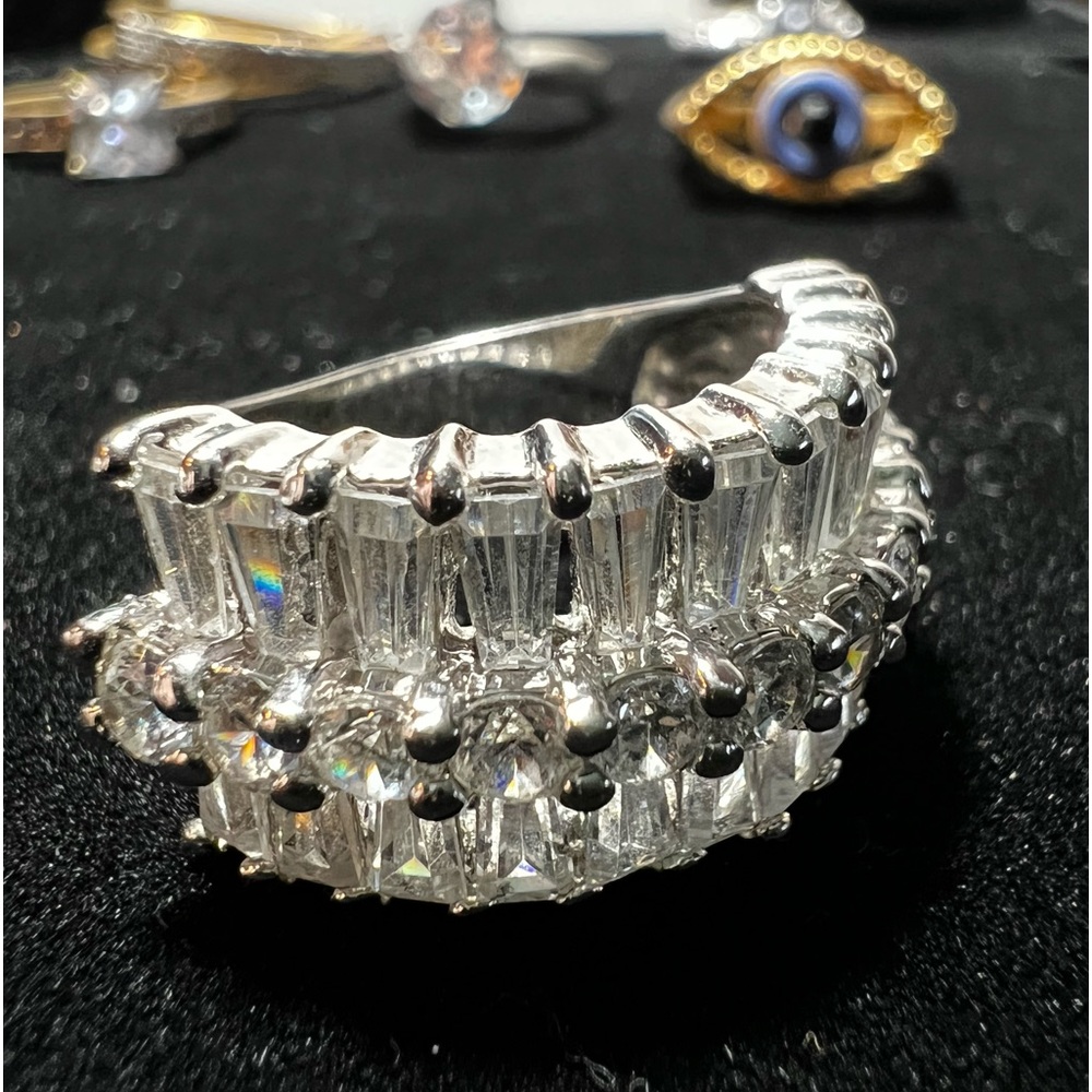 Silver toned ring with CZ stones throughout